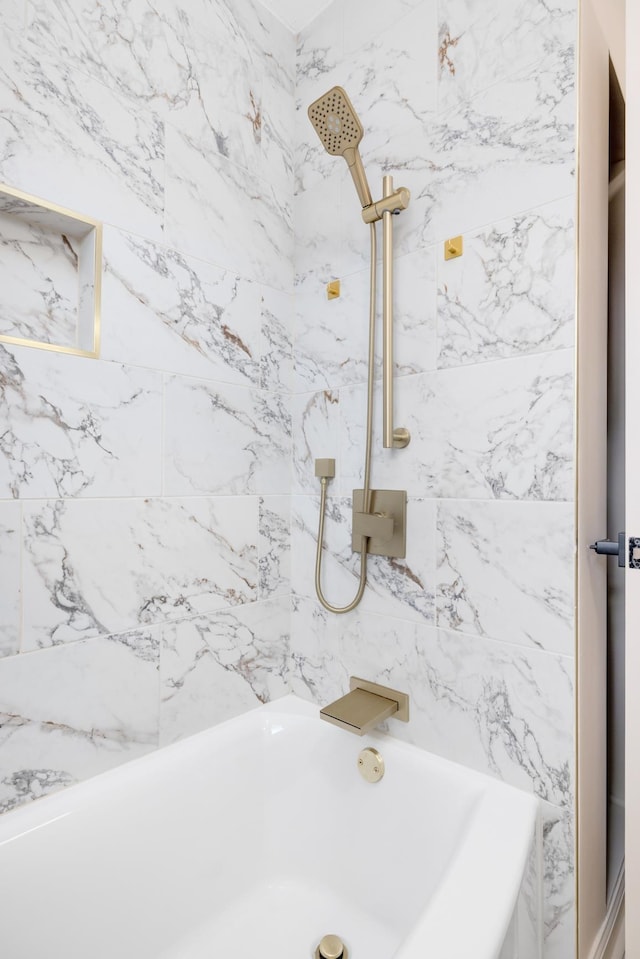 room details featuring tiled shower / bath