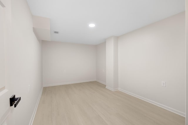 empty room with light hardwood / wood-style floors