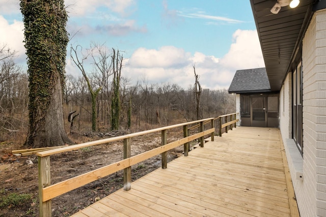 wooden deck featuring a sunroom