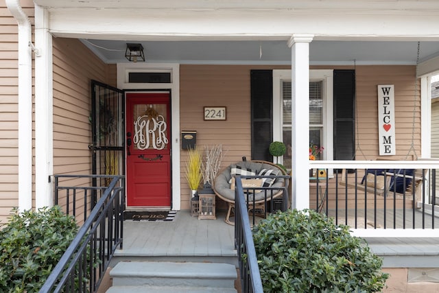 doorway to property featuring a porch