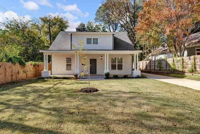 view of front of house with a front yard and covered porch