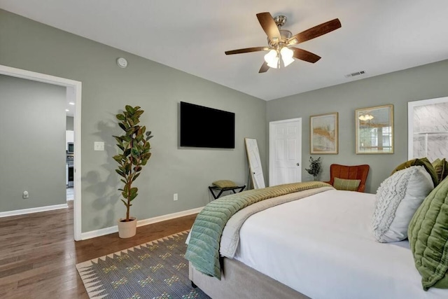 bedroom featuring dark hardwood / wood-style floors and ceiling fan