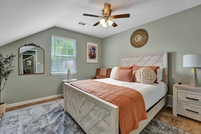 carpeted bedroom with vaulted ceiling and ceiling fan