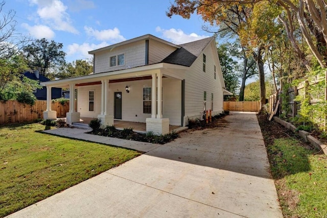 bungalow-style home with a front lawn and a porch