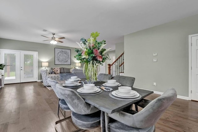 dining area featuring french doors, ceiling fan, and dark wood-type flooring