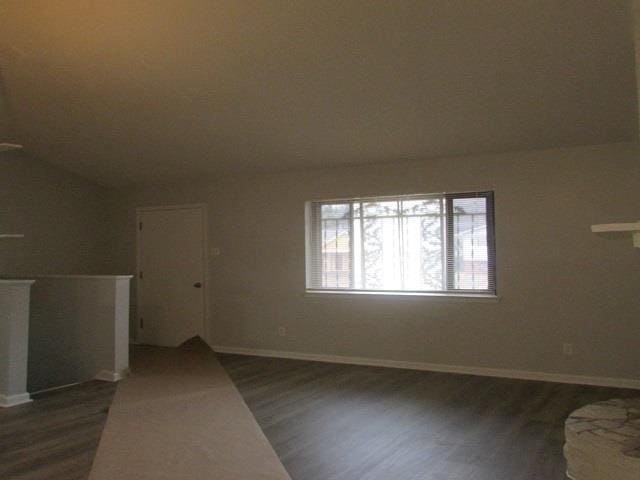 spare room featuring dark hardwood / wood-style flooring