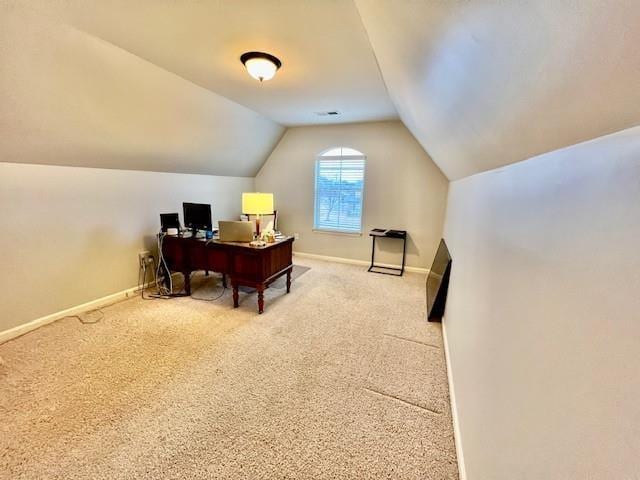 office space with lofted ceiling and carpet flooring