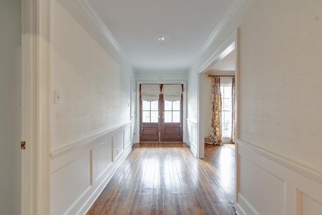 doorway to outside featuring french doors, crown molding, and light hardwood / wood-style floors