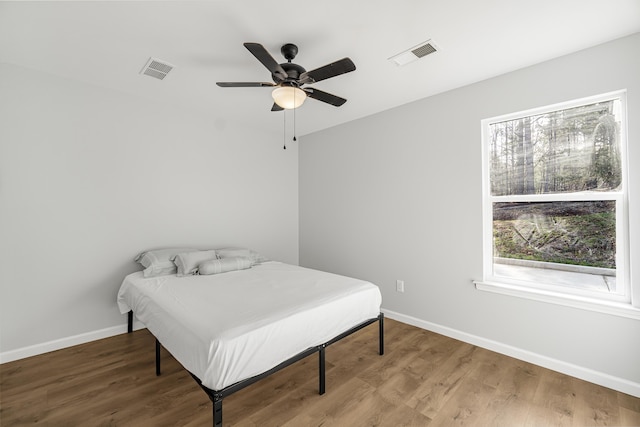 bedroom featuring ceiling fan and hardwood / wood-style floors