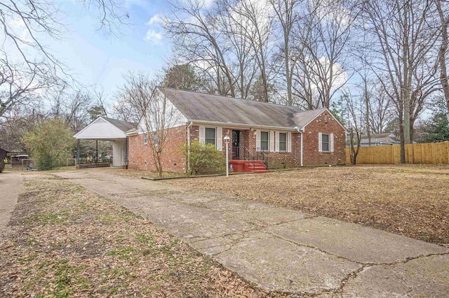 view of front of home featuring a carport