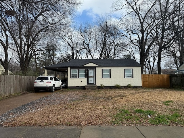 view of front of property featuring a carport