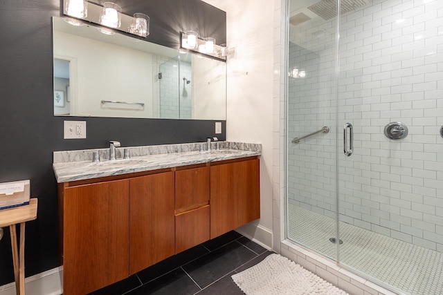 bathroom with vanity, tile patterned flooring, and an enclosed shower