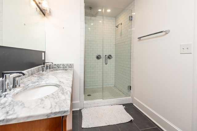 bathroom featuring vanity, tile patterned flooring, and an enclosed shower