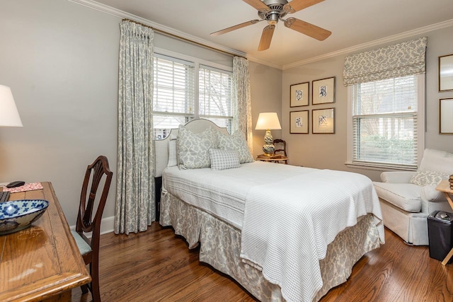 bedroom featuring dark hardwood / wood-style flooring, ceiling fan, and crown molding