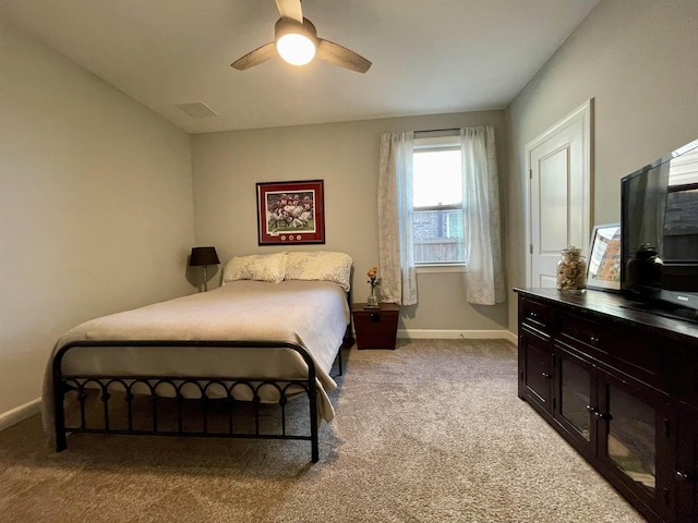 bedroom with light carpet and ceiling fan