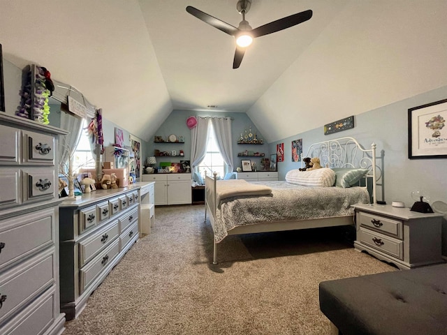 carpeted bedroom featuring lofted ceiling and ceiling fan