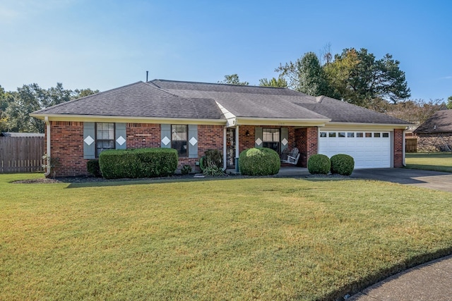 ranch-style house with a garage and a front lawn