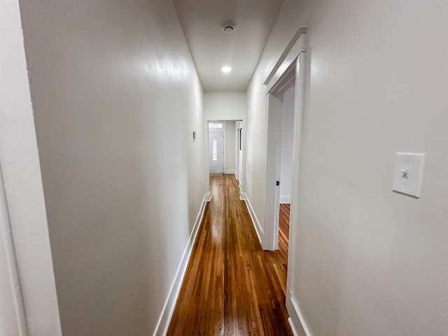 hall with dark hardwood / wood-style flooring