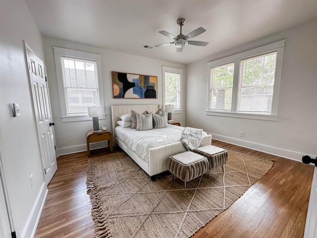 bedroom featuring ceiling fan and wood-type flooring