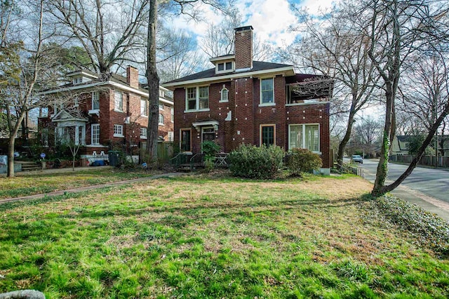 back of house featuring a yard