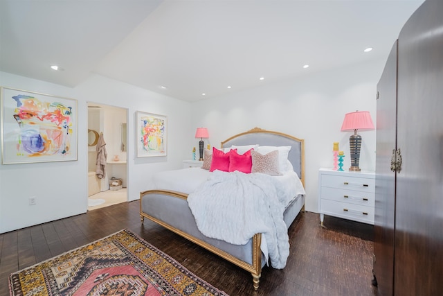 bedroom featuring dark hardwood / wood-style flooring and ensuite bathroom