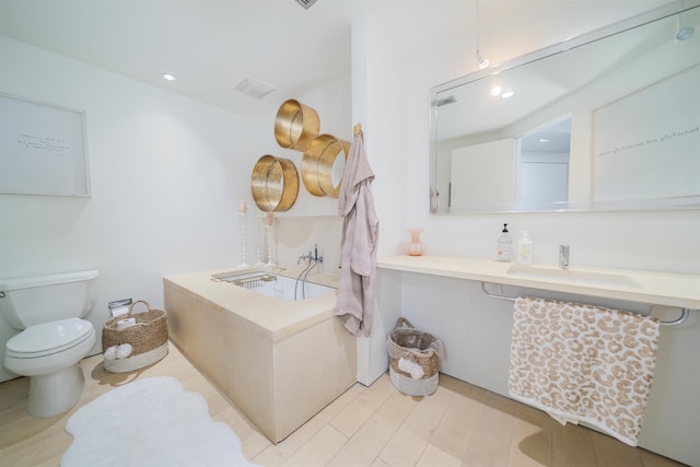 bathroom featuring sink and toilet