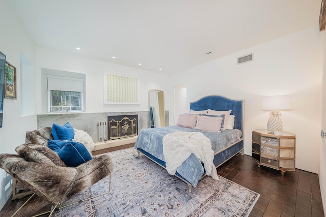 bedroom featuring dark hardwood / wood-style flooring