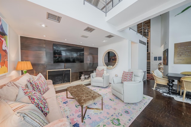 living room featuring a towering ceiling