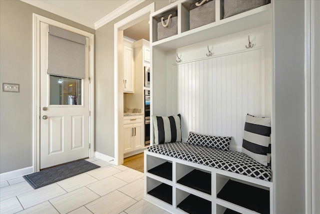 mudroom featuring ornamental molding