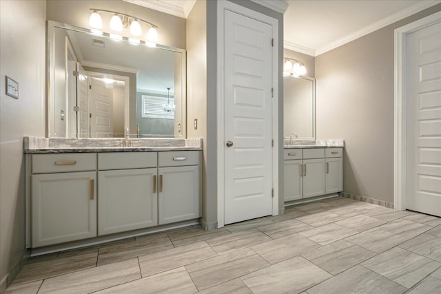 bathroom with vanity and crown molding