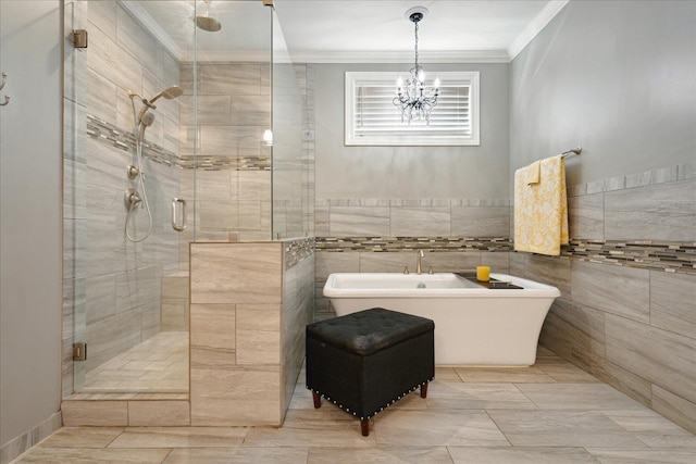 bathroom with separate shower and tub, tile walls, crown molding, and a notable chandelier