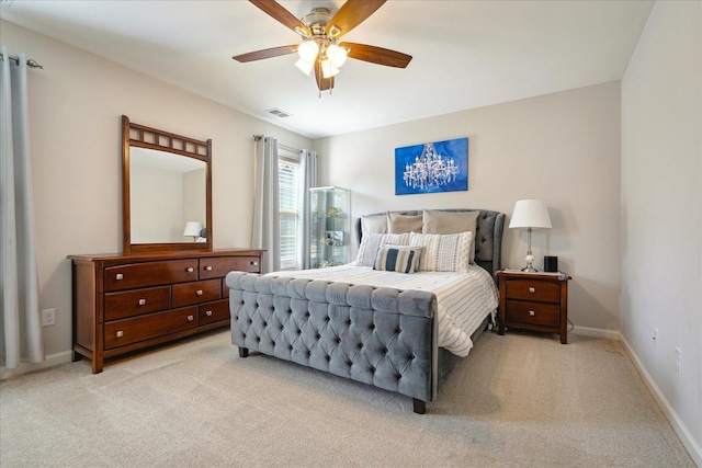 bedroom with light carpet and ceiling fan