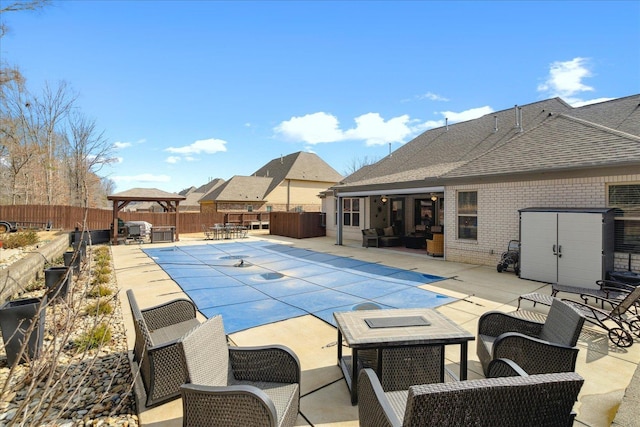 view of pool featuring outdoor lounge area, a patio area, and a gazebo