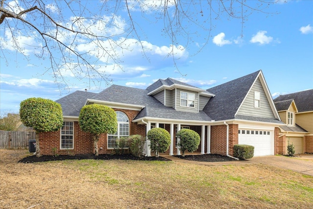 view of front of property featuring a front yard, central AC unit, and a garage