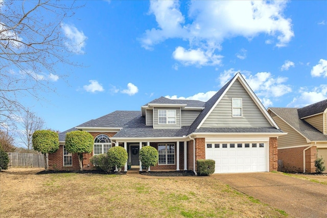 view of front of house featuring a garage and a front lawn