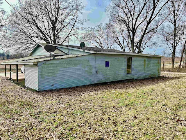 view of home's exterior featuring a yard