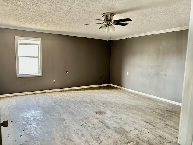 unfurnished room featuring ceiling fan, a textured ceiling, wood-type flooring, and ornamental molding