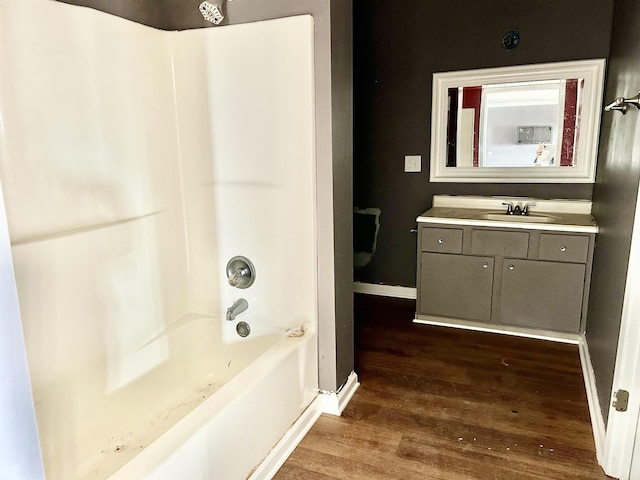 bathroom with vanity, tub / shower combination, and wood-type flooring