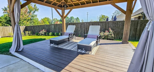 deck with a lawn and a gazebo