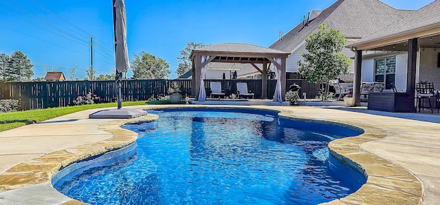 view of pool with a patio and a gazebo