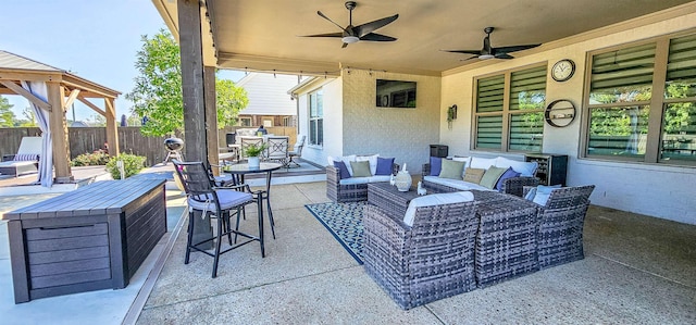 view of patio featuring an outdoor living space and ceiling fan