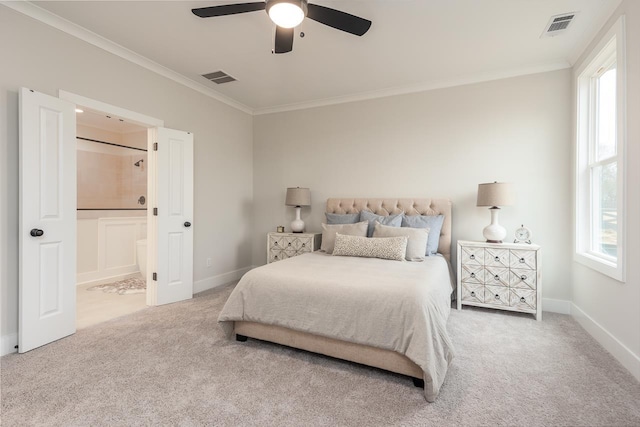 carpeted bedroom with crown molding, connected bathroom, and ceiling fan