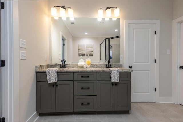 bathroom with tile patterned floors and vanity