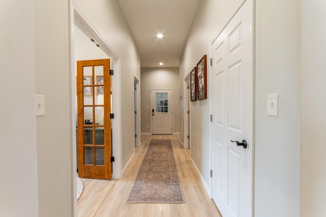 hallway with light wood-type flooring