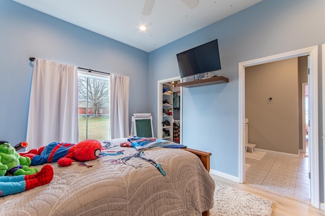 bedroom featuring light hardwood / wood-style floors and ceiling fan