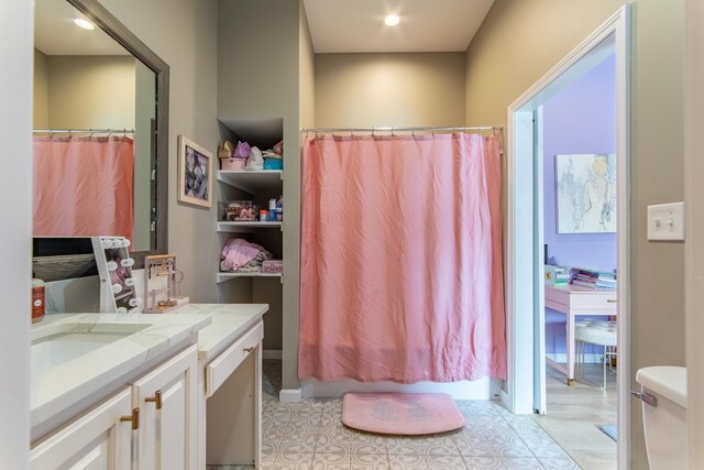 bathroom with toilet and vanity