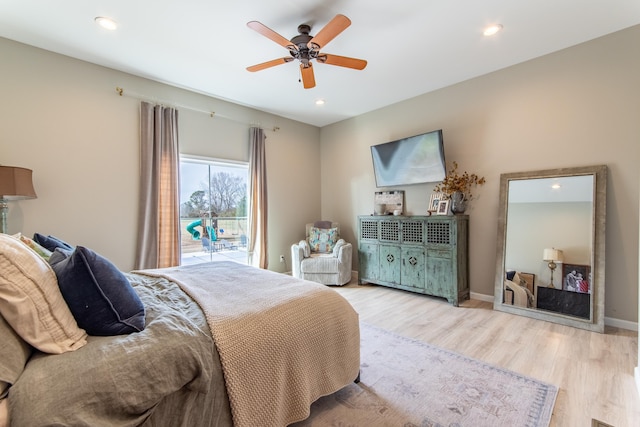 bedroom with light hardwood / wood-style flooring and ceiling fan