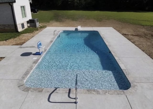 view of pool featuring central AC