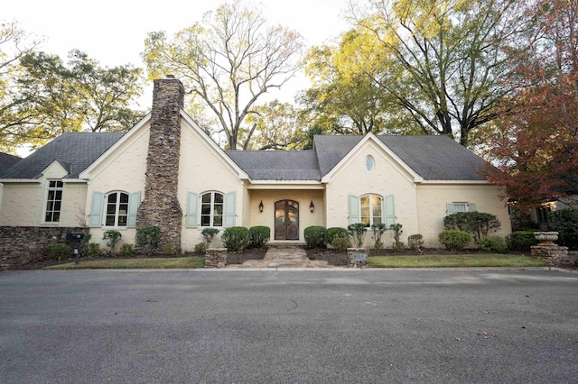 view of french country inspired facade