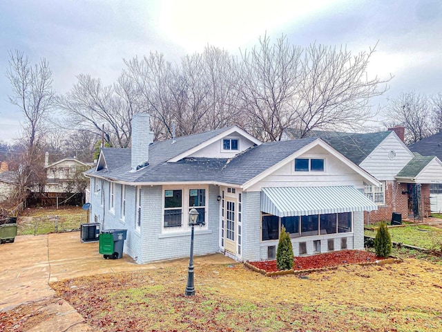 view of front of house featuring cooling unit